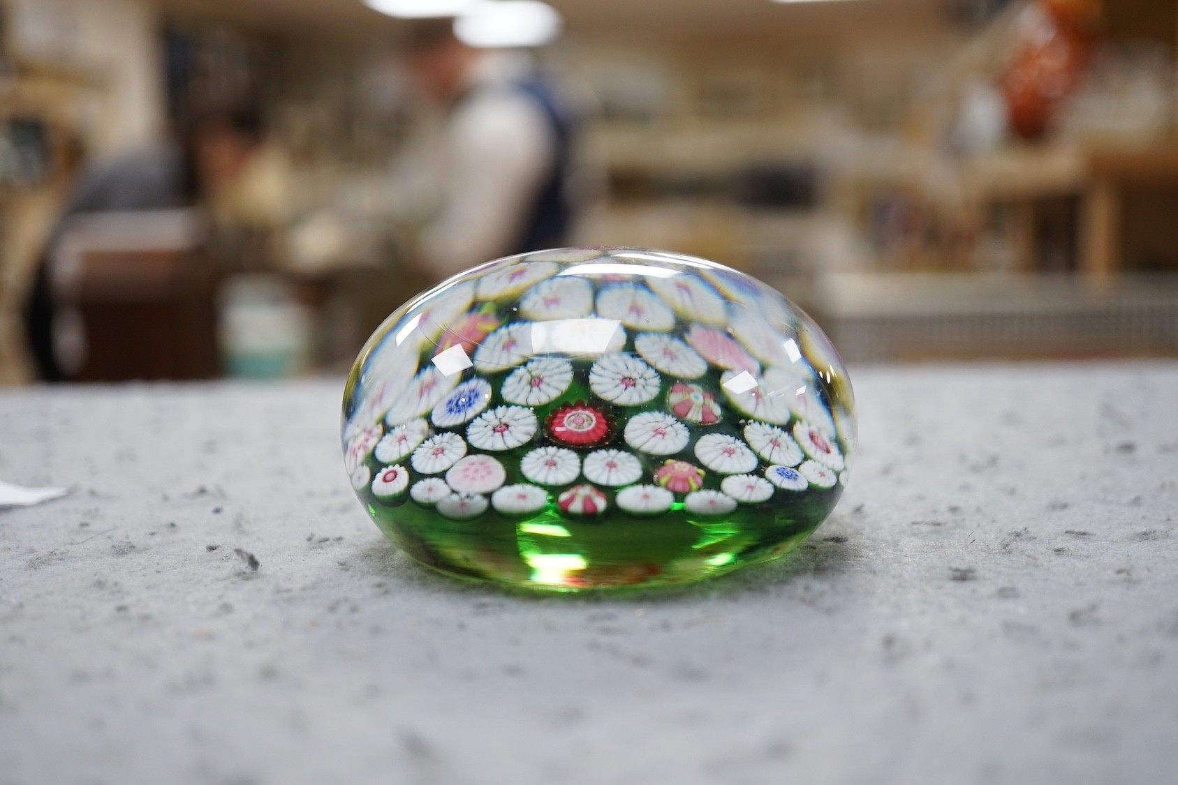 A 19th century French glass millefleur spaced cane paperweight, 8.5cms diameter